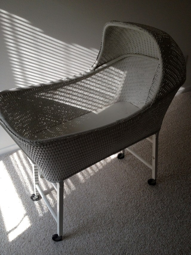 white wicker bassinet